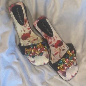 This brand is Pierre Dumas, vintage slides with small wedge